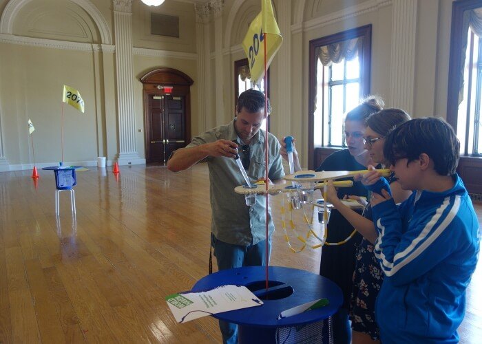 4 players at a generation station taking on sea level rise